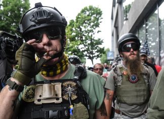 Facebook banned violent militia groups. We still found plenty of them on its platform.